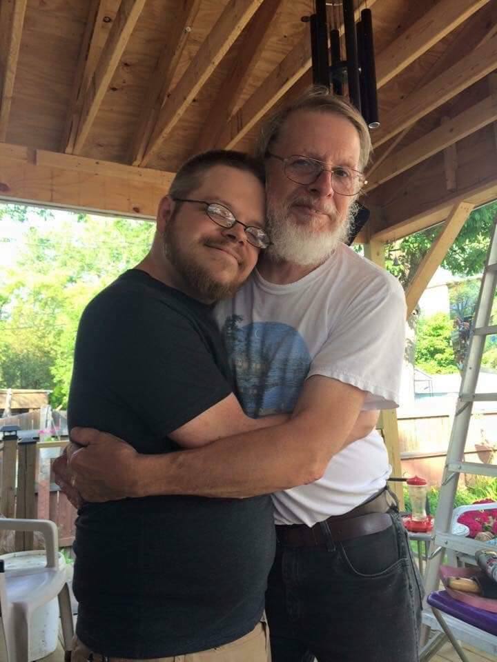 My dad and I hugging each other on the back porch of my parent's house in Niagara Falls, NY.