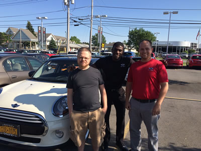 My new MINI Cooper Hardtop 4 Door, Alan and Chris from Towne MINI, and myself.