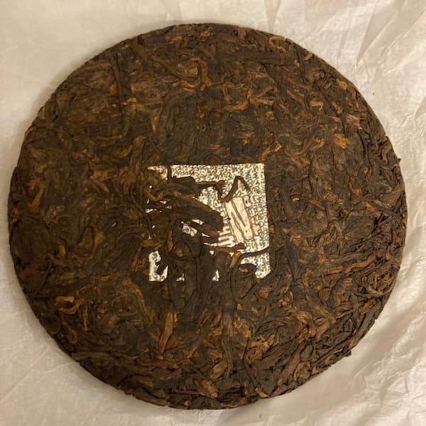 the un-wrapped tea cake, dark brown leaves