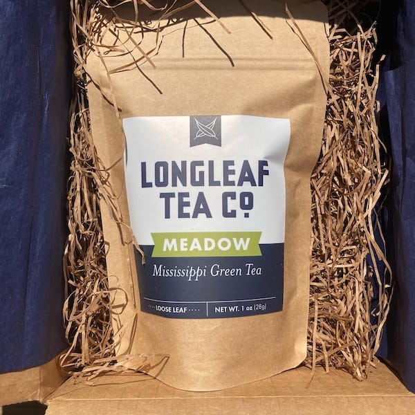 the loose tea in a brown mylar package with the Longleaf Tea Company branding