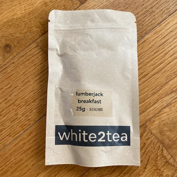 a tan colored mylar package with the wording Lumberjack Breakfast 25g white2tea